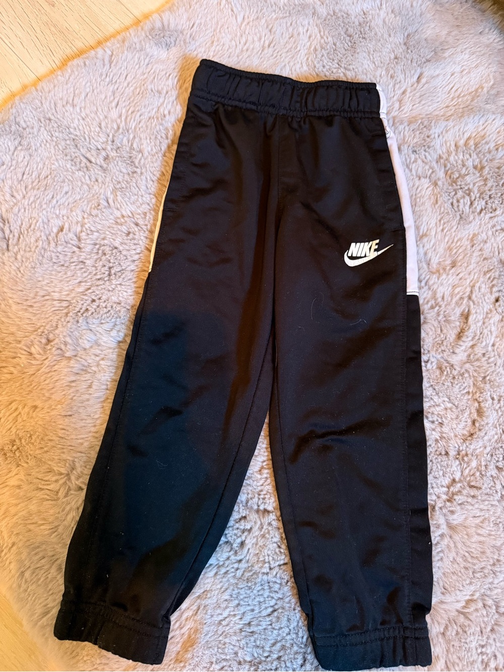 Nike Kids Black Joggers with White Swoosh & Side Stripe
